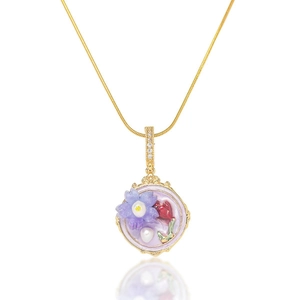 Golden chain necklace with a vintage purple flower pendant and pearl inlay details