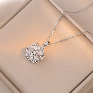 Elegant floral heart necklace with zircon inlay on a champagne satin display box