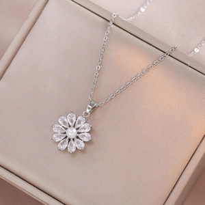Silver necklace featuring a flower pendant with center pearl and zircon petals