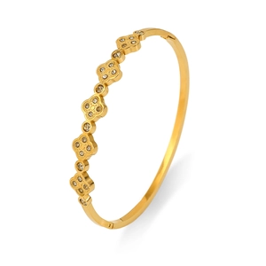 Eleganter goldener Kleeblatt-Armreif aus Titanstahl mit funkelnden Diamanten besetzt