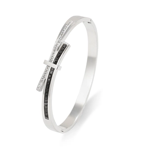 Polished stainless steel crossover bangle with black and white zircon stone inlay