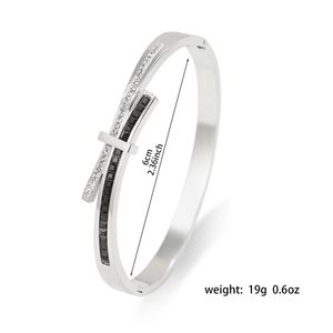 Detail shot showing 6cm diameter and 19g weight of silver geometric pavé bangle