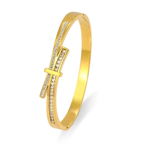 Macro shot of gold-plated stainless steel oval bracelet with pavé-set white rhinestones