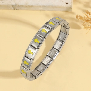 Italian charm bracelet with stainless steel links and yellow cross motifs on a soft background