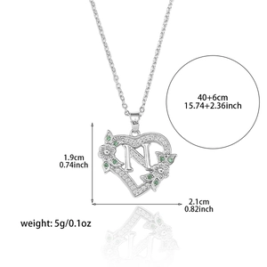 Silver tone heart necklace with letter N pendant, green accents and size dimensions