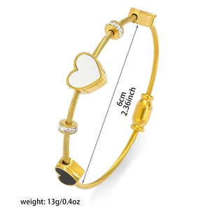 Bracciale rigido minimalista in acciaio al titanio dorato con cuori e cristalli