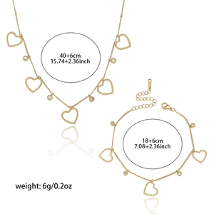 Elegante gouden titanium sieradenset met holle hartvormige hangers en fonkelende stenen