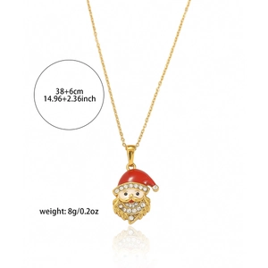 Detail of Santa Claus pendant with red enamel and crystals on golden chain necklace