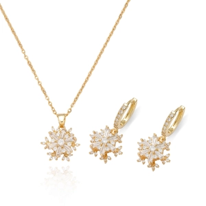 Elegante goudkleurige sneeuwvlok sieradenset met sprankelende zirkonia ketting en oorbellen
