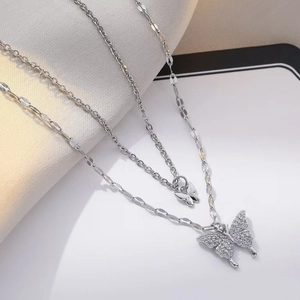 Double layered bow necklace in silver finish with pavé zircon butterfly pendants