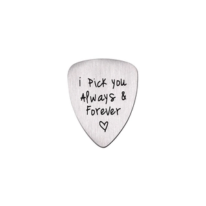 Detailed view of brushed stainless steel guitar pick with Always & Forever engraving