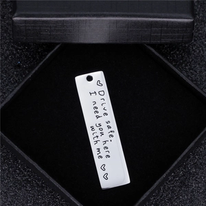 Polished rectangular Drive Safe stainless steel keychain in a black gift box