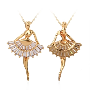 Gold plated ballet dancer necklace with baguette cut zircon stones on white background