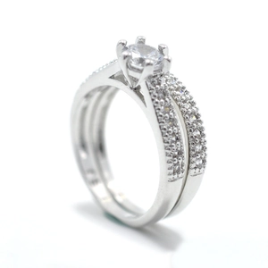 Elegant two-piece engagement ring set with six-prong round zircon in polished silver finish