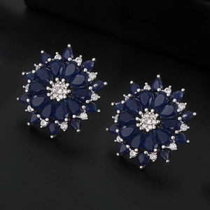 Elegant flower-shaped earrings with blue pear-cut sapphires and white cubic zirconia