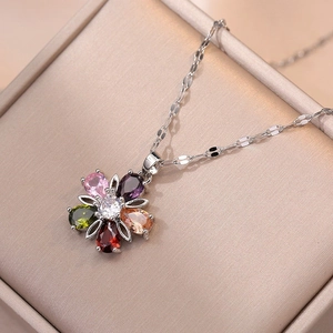 Colorful floral gemstone pendant necklace with silver chain on premium jewelry box