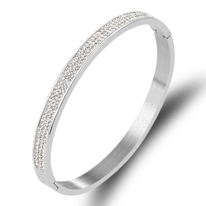 Bracelet charnière en acier inoxydable brossé avec trois rangées de cristaux brillants