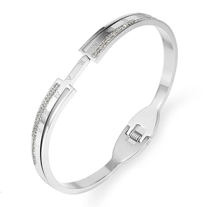 Polished silver stainless steel bangle with Roman numerals and pavé diamonds inlay