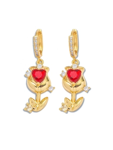 Golden flower earrings featuring vibrant red heart-shaped crystals and zircon accents