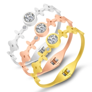 Polished stainless steel bracelets in gold, silver, and rose gold with zircon inlay