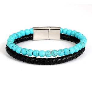 Detail of blue turquoise beads and black braided leather bracelet with magnetic steel clasp