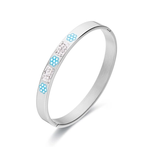 Polished stainless steel cuff bracelet with blue enamel flowers and white zircon stones