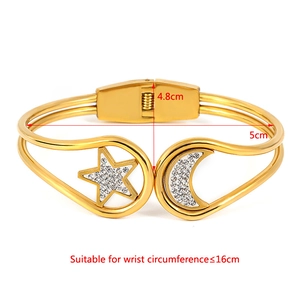 Star and moon gold stainless steel cuff bracelet shown with size measurements for 16cm wrists