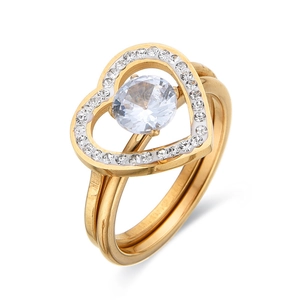 Two-in-one interlocking gold heart ring set with paved diamonds and a round center stone