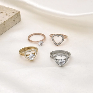 Detail view of heart-shaped ring set with zircons on elegant white silk background