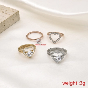 Detail view of heart-shaped stacking rings with 6mm stone and gold plating finish