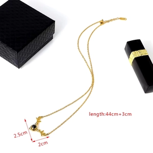 Detailed view of golden deer antler necklace with 100 languages projection stone