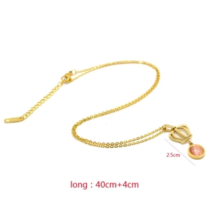 Detail view of crown necklace with pink gemstone pendant and adjustable lobster clasp