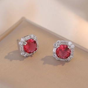 Silver stud earrings with round red gemstone and square halo of white zircons