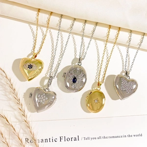 Elegant gold and silver locket necklaces with zircon evil eye and butterfly designs