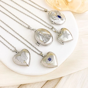 Silver locket necklace set with heart and oval pendants featuring sparkling zircon micro-paving