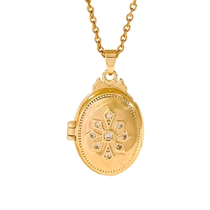 Gold oval locket necklace with sparkling starburst zircon pattern on a cable chain