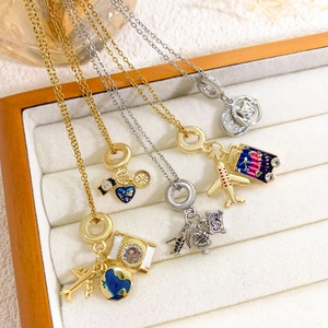 Travel themed necklace set with camera globe and airplane pendants in gold and silver finish