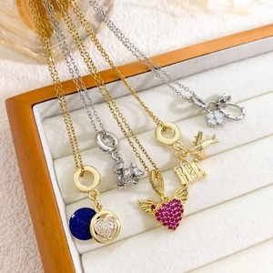 Titanium steel travel necklaces with airplane and heart pendants on velvet display tray