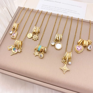 Golden pendant necklaces with colorful zircon stones on leather jewelry display