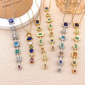 Elegant gold and silver necklaces featuring multi-colored geometric gemstone pendants