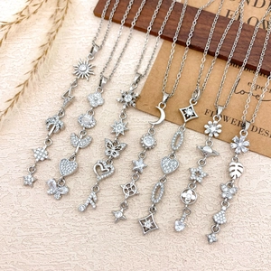 Elegant silver necklaces with sun moon and star pendants featuring cubic zirconia inlays