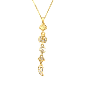 Exquisite gold necklace featuring sun, moon, and star pendants with micro-pave zircons