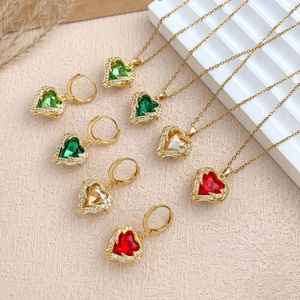 Elegant gold heart necklaces and earrings set with colorful crystals and diamonds