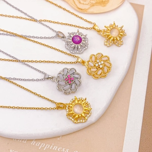 Five rotating sunflower and geometric necklaces with colorful gemstones in gold and silver