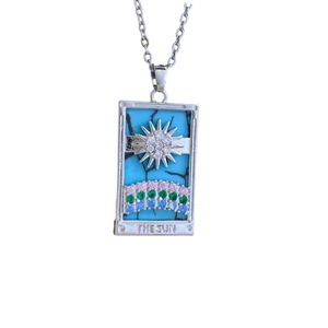 Silver Tarot Sun necklace with blue marble pendant and colorful gemstones on white background