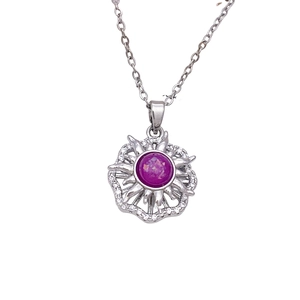 Rotating sunflower necklace with purple opal center and shimmering silver-tone sun rays