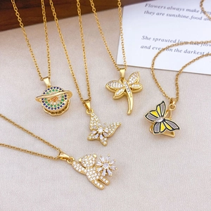 Gold stainless steel rotating evil eye necklaces with saturn butterfly and bear charms