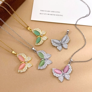 Collection of butterfly necklaces in gold and silver finish with colorful opal stones