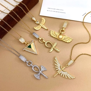 Ancient Egyptian style Ankh cross and winged idol necklaces with zirconia in gold and silver