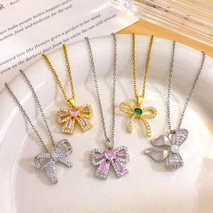 Elegant bow knot zircon necklaces in gold and silver finish with pink heart stones